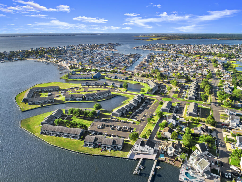 Aerial view of Mariners Cove's water front community with apartment buildings